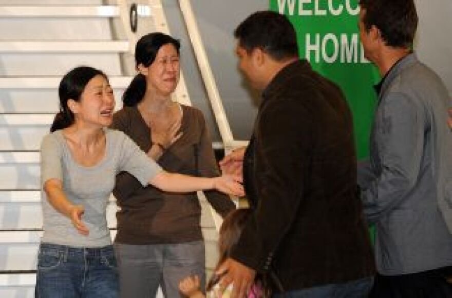 Lisa Ling (right) is relieved to see her sister Laura arrive safely home after five months in North Korean custody.