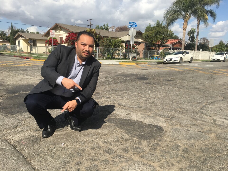 Lynwood Mayor Jose Luis Salache on deteriorated Duncan Avenue whose repair is accelerated with money from SB1, California's new gas tax.