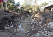 Montecito Creek just north of East Valley Road (aka Route 192) overflowed its banks. The mud rose so high it left a mark five feet high on the white house on the creek's edge. The debris tore through that home's garage and some front rooms. Downstream, the same debris flow ruined several more nearby homes.