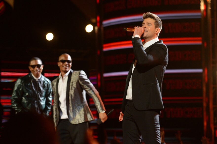 LOS ANGELES, CA - JUNE 30:  (L-R) Recording artists Pharrell Williams, T.I. and Robin Thicke perform onstage during the 2013 BET Awards at Nokia Theatre L.A. Live on June 30, 2013 in Los Angeles, California.  (Photo by Jason Merritt/Getty Images for BET)