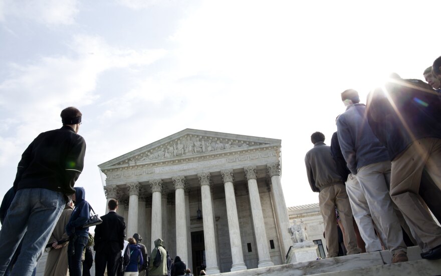 File: People wait to enter outside the U.S. Supreme Court March 21, 2011 in Washington, D.C.