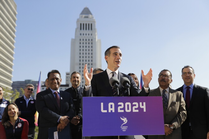 FILE - In this Jan. 25, 2017, file photo, Los Angeles Mayor Eric Garcetti, center, speaks during a news conference in Los Angeles. 