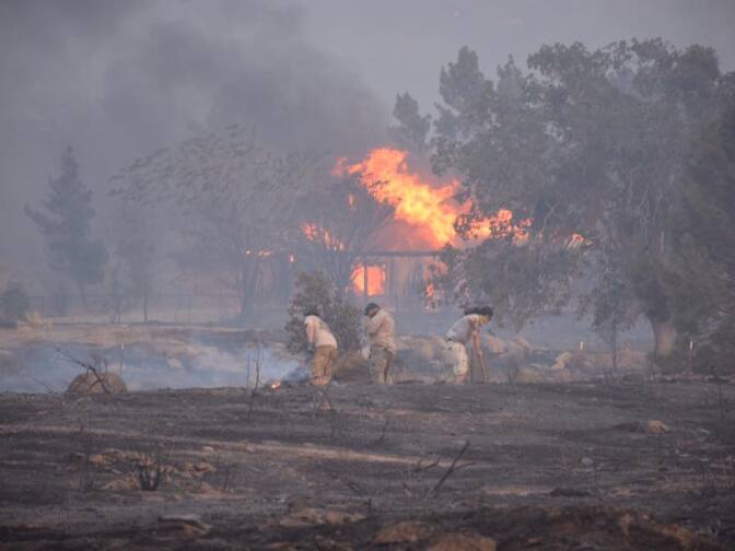 A photo from the Kern County Fire Department shows a new wildfire that broke out late Thursday, June 23, 2016, quickly tearing through dozens of homes and prompting evacuations.