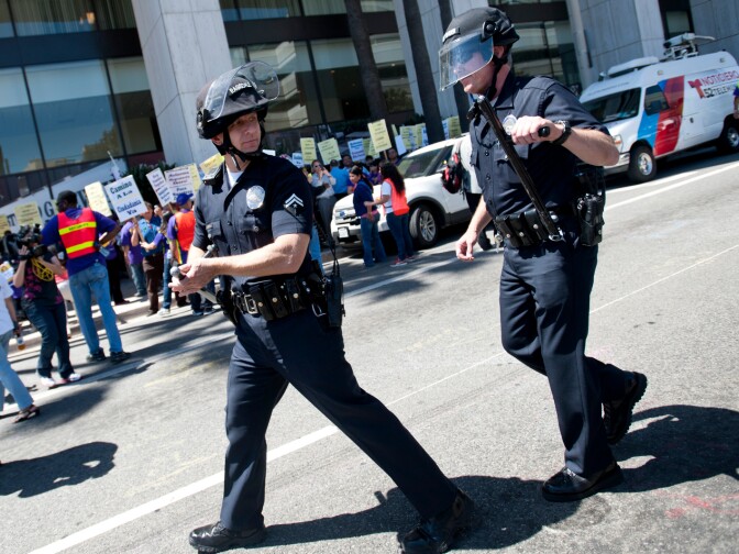 LAPD put on helmets, and take stance around the march. Hundreds of immigration reform supporters took part in a march on Wednesday to Senator Diane Feinstein's LA office. The march coincides with a immigration reform rally in Washington D.C.