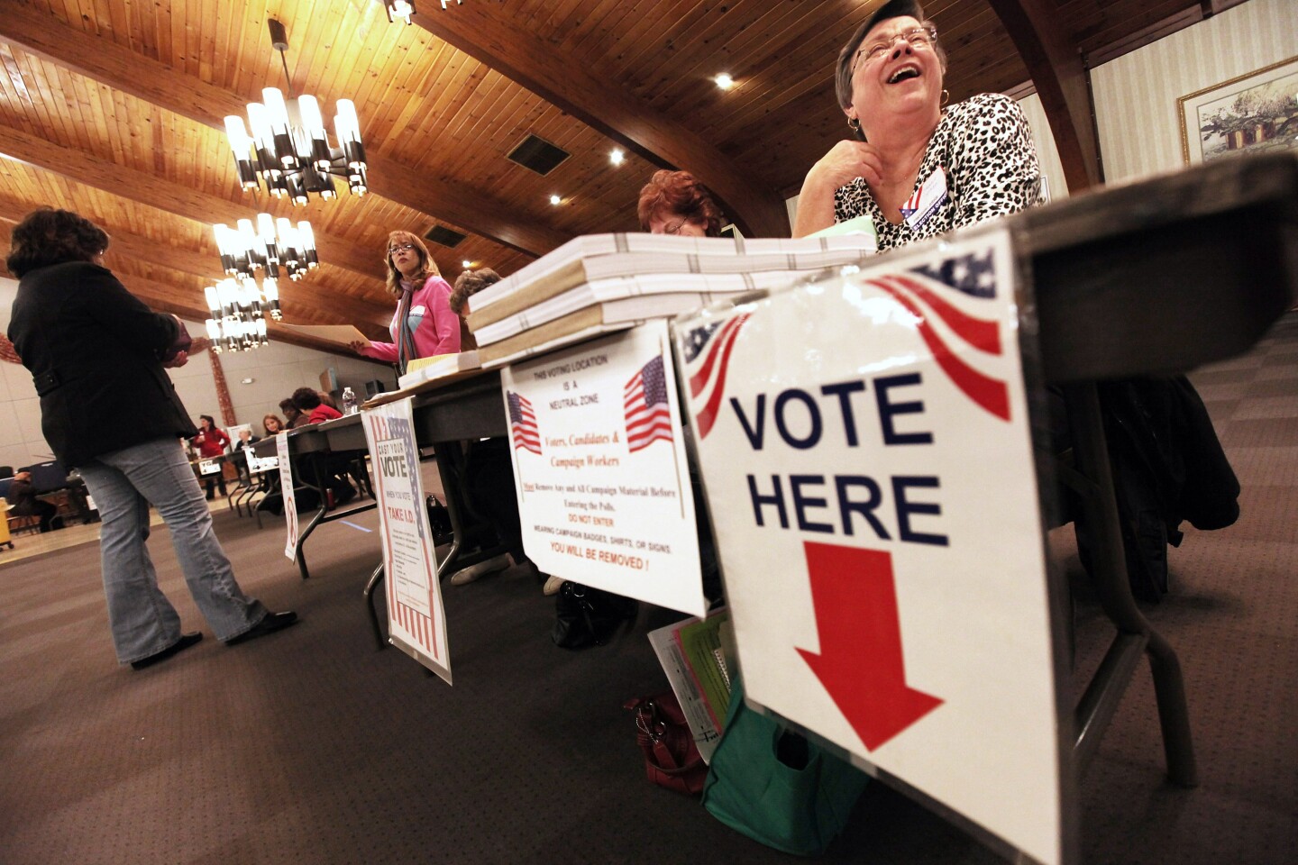 Poll workers look on at a polling place during Super Tuesday voting on March 6, 2012 in Youngstown, Ohio. The two top Republican presidential candidates Mitt Romney and Rick Santorum are running neck and neck in the state.  