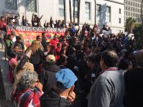 Street vendors and their advocates celebrate outside L.A. City Hall on Wednesday, Nov. 28 after the City Council unanimously approved a plan to legalize street vending and let vendors take out permits.

