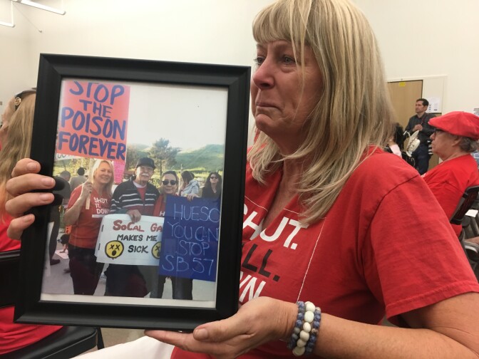 Deirdre Bolona displayed a photo of her and her late father Matt Koenig at a state legislative oversight hearing about the Aliso Canyon natural gas disaster. 