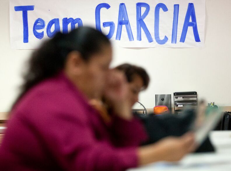 Signs fill incumbent LAUSD Board President Monica Garcia's East LA campaign offices as volunteers work to gather support leading up to the March 5 elections.