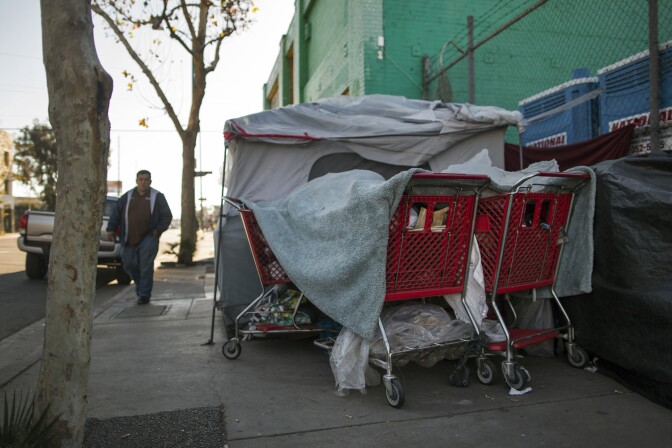 File: A tent stands on E Sixth Street at Gladys Avenue in Skid Row on Thursday morning, Dec. 17, 2015. 