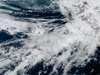 A satellite image of an atmospheric river – in the form of clouds – running into California.