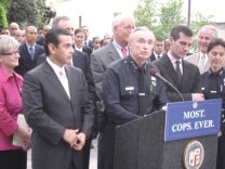 Los Angeles officials seek the public's input on who should replace this man.  One of the candidates is the woman on the far right, LAPD Assistant Chief Sharon Papa.
