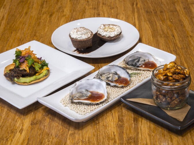 BBQ Korean short rib tostada with Kimchi, herbs and avocado salsa, honey roasted peanuts with Togarashi, Banana and Chocolate creampie and Oyster Cocktails.