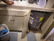 The family's leaking water heater has been replaced. The water heater was a main source for their cockroach infestation. The tenants of this apartment building organized and began working with Strategic Actions for a Just Economy, a non-profit dedicated to tenant rights.