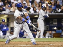 SAN DIEGO, CA - AUGUST 30:  Yasiel Puig #66 of the Los Angeles Dodgers hits a single during the eighth inning of a baseball game against the San Diego Padres at Petco Park August, 30, 2014 in San Diego, California.  (Photo by Denis Poroy/Getty Images)