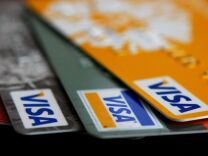 Visa credit cards are arranged on a desk February 25, 2008 in San Francisco, California. Visa Inc. is hoping that its initial public offering could raise up to $19 billion and becoming  the largest IPO in U.S. history.