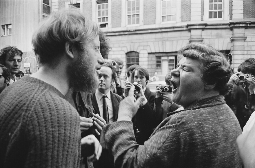 A local woman argues with one of the squatters occupying a building on Endell Street, London, 1969. (Photo by William Lovelace/Daily Express/Hulton Archive/Getty Images)