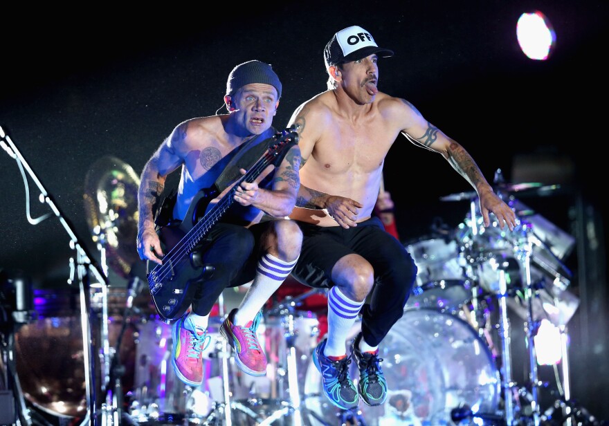 Musicians Flea and Anthony Kiedis of Red Hot Chili Peppers perform onstage during day 3 of the 2013 Coachella Valley Music & Arts Festival at the Empire Polo Club on April 14, 2013 in Indio, California.  