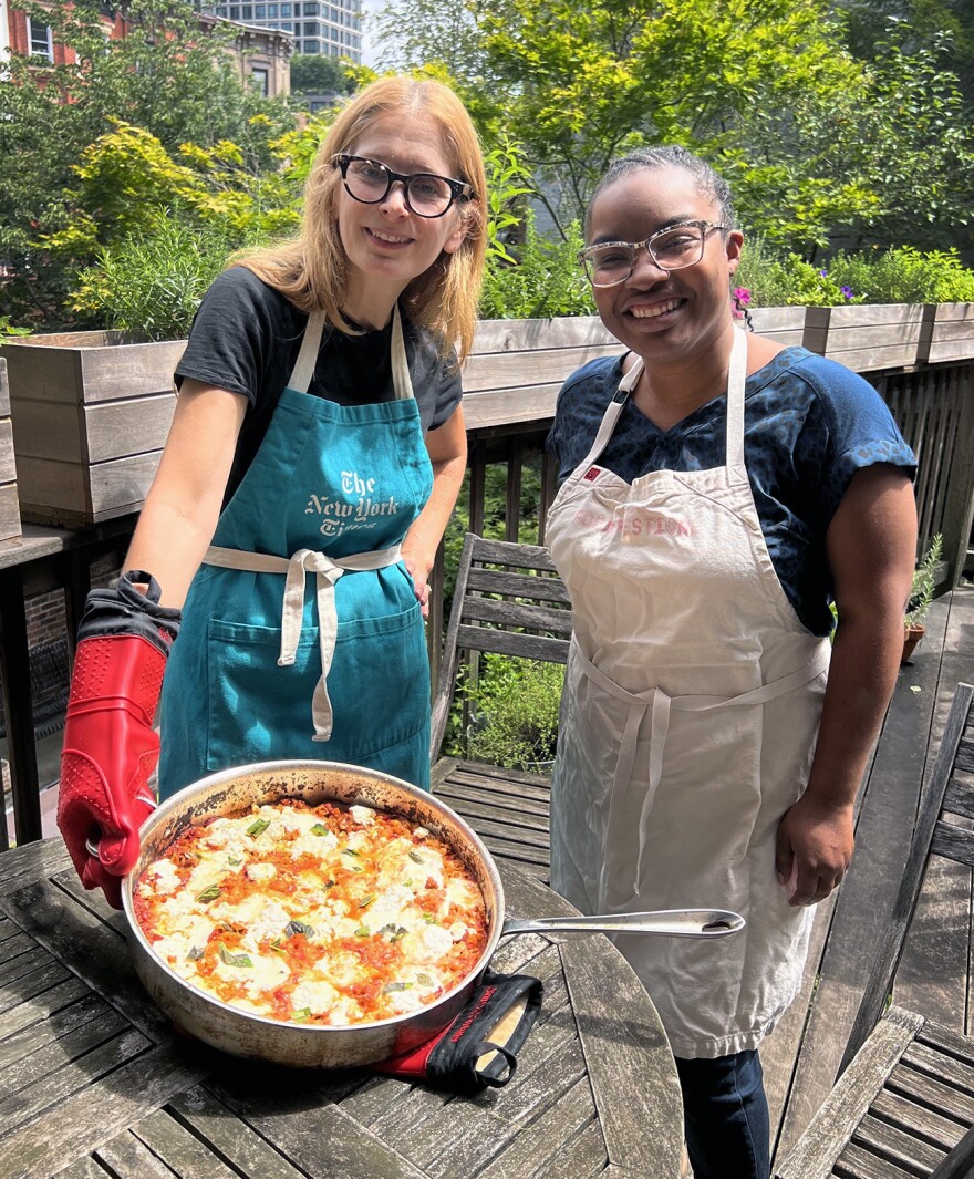 Melissa Clark and NPR's Ayesha Rascoe pose with the cheesy baked pasta.