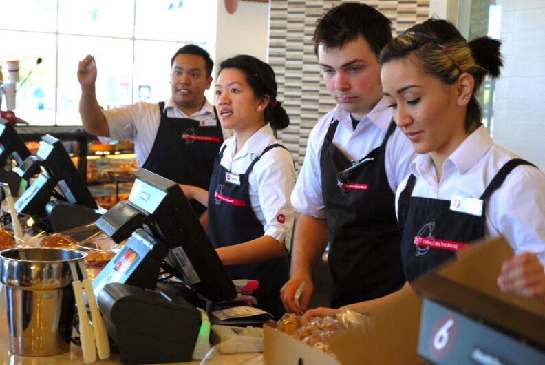 WEST COVINA, Calif. -- Storefront employees ring up customers during the lunch rush at the new 85°C Bakery Cafe on Jan. 16. This company-owned West Covina location is the third to open in the United States, with more openings planned throughout Southern California. The Taiwan-based chain, while new to the U.S. market, operates more than 700 stores worldwide.