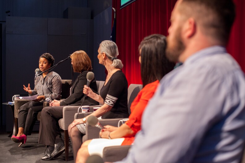 Priska Neely (L) hosts a panel conversation at the Crawford Family Forum in March 2017.