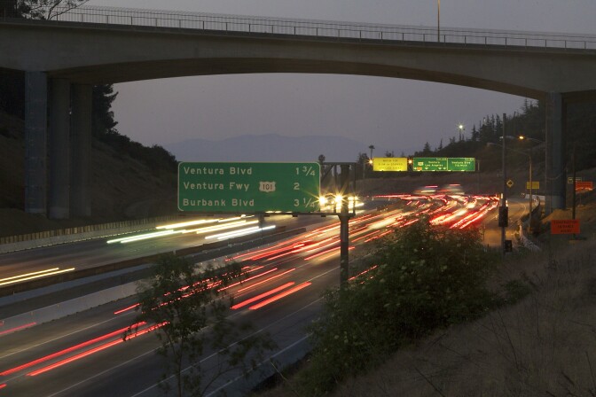 Northbound Interstate 405 traffic flows under the Mulholland Bridge at the top of Sepulveda Pass in Los Angeles Tuesday, July 12, 2011. Starting July 16, 11 miles of the 405 Interstate which carries some 500,000 cars daily over the mountain pass into the San Fernando Valley, will shut down for 53 hours. (AP Photo/Damian Dovarganes)