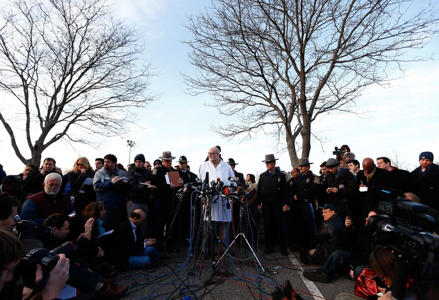 Connecticut Chief Medical Examiner H. Wayne Carver II talks to the media and answers questions about the elementary school shooting during a press conference at Treadwell Memorial Park on December 15, 2012 in Newtown, Connecticut.