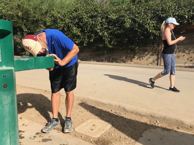 Hancock Park resident Ron Niv cools down at the Runyon hiking trails. Los Angeles beat the all-time record hitting 92 degrees on Thanksgiving day.