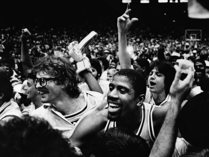 After Lakers won the world title in 1982, fans stormed onto Forum floor and celebrated with the players, including Kurt Rambis and Magic Johnson.