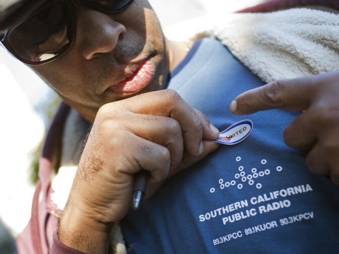 Al Gordon puts on his "I Voted" sticker after voting in the Los Angeles County primary election on Tuesday, March 3, 2015 at Saint Mary of the Angels in Los Feliz.