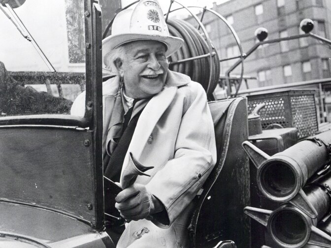 Arthur Fiedler, called a "public safety groupie" by his son, enjoyed chasing fires and other disasters around the city of Boston. (photograph ca. 1955)