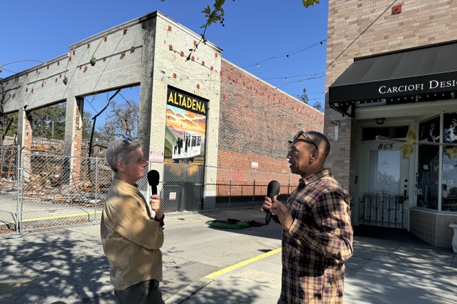 Two men speak into microphones outdoors in Altadena, California. 