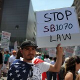 NEW YORK - MAY 01:  Hundreds of activists, supporters of illegal immigrants and members of the Latino community rally against a new Arizona law in Union Square on May Day on May 1, 2010 in New York City. Following the state of Arizona's passage of a new immigration law which requires individuals suspected of being illegal immigrants to show proof of legal residence when asked by law enforcement, immigration supporters have been protesting across the country. The law has become increasingly divisive, with Mexico's president issuing a travel warning to Mexican citizens in Arizona. Thousands of people are taking part in similar protests around the country on May Day, a traditional day of protest around the world.  (Photo by Spencer Platt/Getty Images)