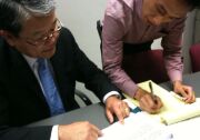Los Angeles County Chief Executive Officer Bill Fujioka explains his proposed 2011-2012 budget to a reporter at a news briefing at the Hall of Administration.