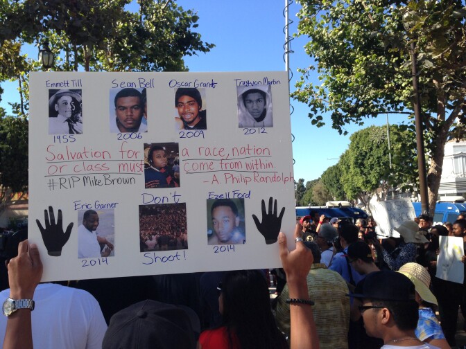 Protesters denounce the shooting of youth by police in Leimert Park on Thursday, Aug. 14, 2014.