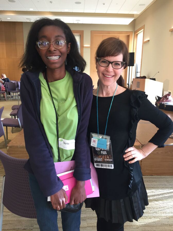 Lauren Cook, left, works with singer-songwriter Lisa Loeb on Saturday, Feb. 27, 2016 during a workshop at the Huntington Library in Pasadena. The workshop was Cook's first time writing song lyrics. Loeb chose to set her lyrics to song and perform them for the group.
