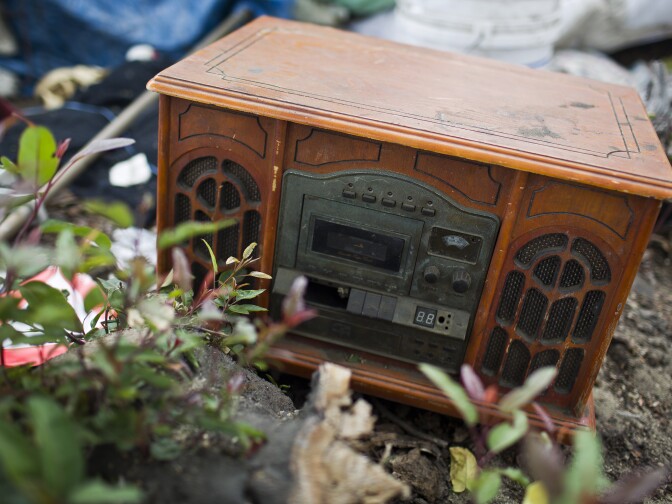Jesus Torres goes through dumpsters looking for possibly valuable items like this tape cassette player.