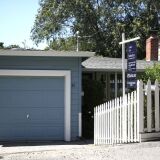 SAN ANSELMO, CA - JULY 18:  A sign is posted in front of a home for sale on July 18, 2017 in San Anselmo, California.  California is experiencing a housing crisis with a low number of afforable homes for sale. The State's median home price is around $500,000 and some areas are well over a a million dollars.  (Photo by Justin Sullivan/Getty Images)