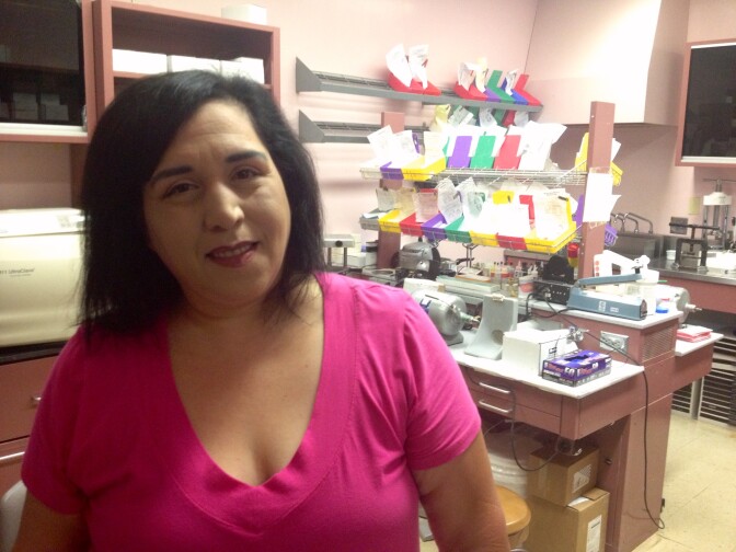 Elvira Cordero, 43, has been wearing the dentures she received from Watts Health Center for three years now. She spent about two years looking for affordable treatment for a serious, chronic mouth infection; while she was doing that, eight of her teeth fell out.