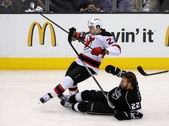 David Clarkson #23 of the New Jersey Devils and Trevor Lewis #22 of the Los Angeles Kings collide during a play in Game Six of the 2012 Stanley Cup Final at Staples Center on June 11, 2012 in Los Angeles, California. 