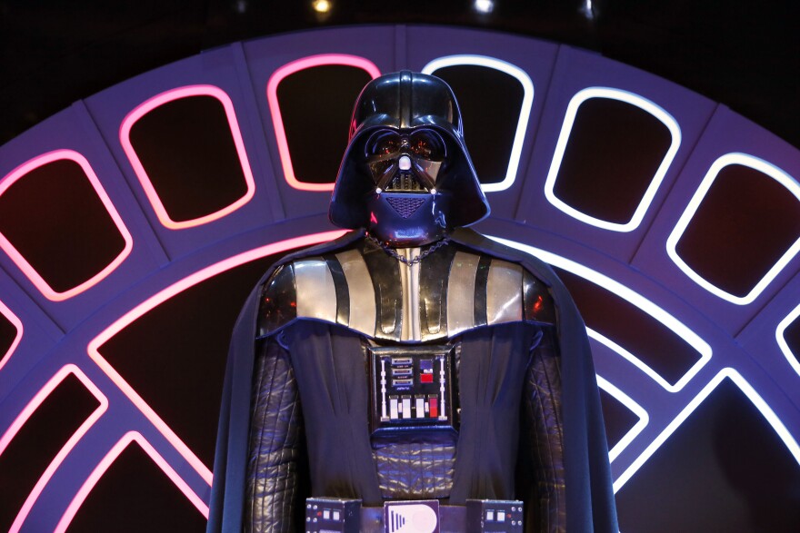 File: A Darth Vader costume from the Star Wars film series is displayed during the presentation of the exhibition 'Star Wars Identities' at the Cite du Cinema in Saint-Denis, outside Paris, on Feb. 13, 2014.