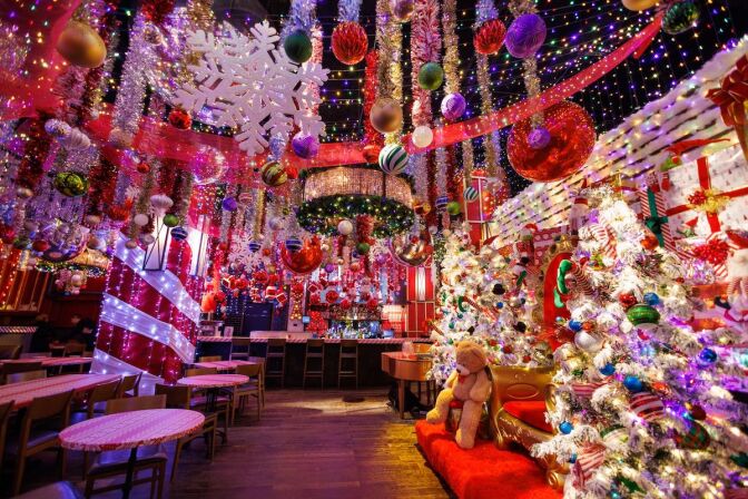 A holiday-themed bar is decked out in Christmas decorations. 