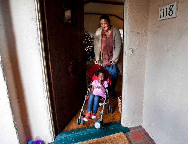 Trista Schroeder takes Luli out for a walk after work and school. Sparks says parents "need to give honest answers in simple language," and work on feeling comfortable talking about color.