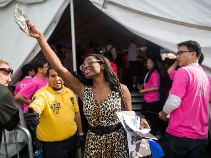 Siobhan Porter, 29, traveled from Miami, Fl., for the KCON convention. She celebrates after scoring a prized autograph from one of her favorite groups.