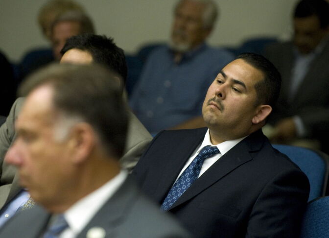 Fullerton police officer Manuel Ramos listens as Judge Walter Schwarm explains why he believes all charges should stand and why he believes Ramos and Fullerton police officer Jay Cicinelli should stand trial for the death of Kelly Thomas.