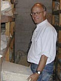 John Camp holds a stone tablet from about 300 B.C. honoring a statesman named Callius, unearthed from the Agora site. There are more than 7,000 such tablets in storage. For a larger image, see the photo gallery.
