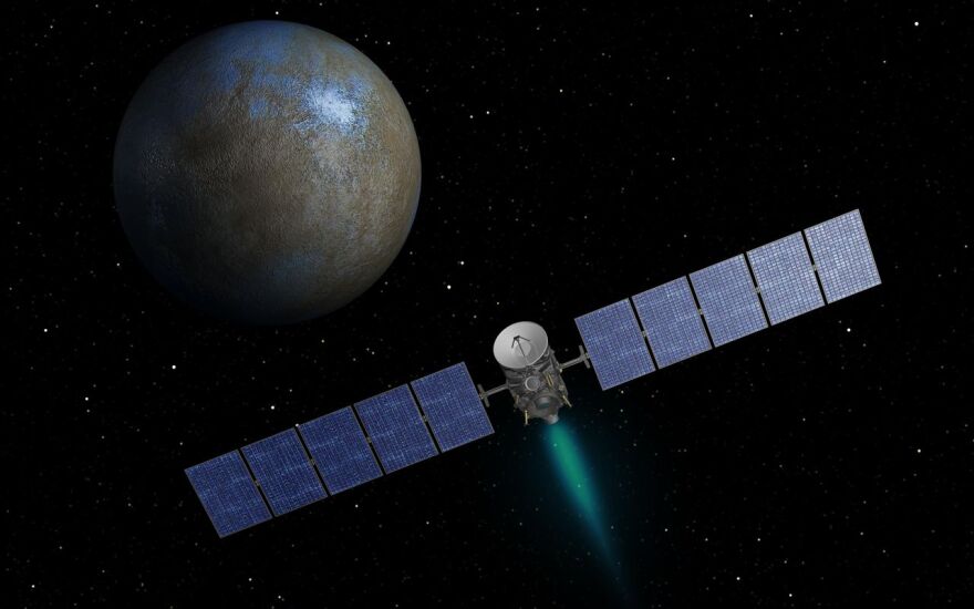 This artist's concept shows NASA's Dawn spacecraft heading toward the dwarf planet Ceres.