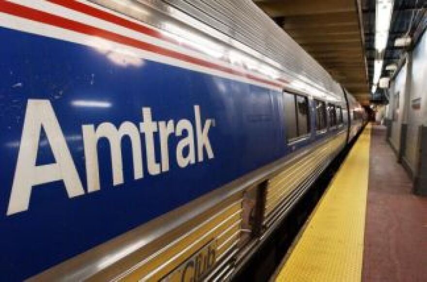 In this 25 October, 2002. file photo, an Amtrak train sits idle at Penn Station in New York.