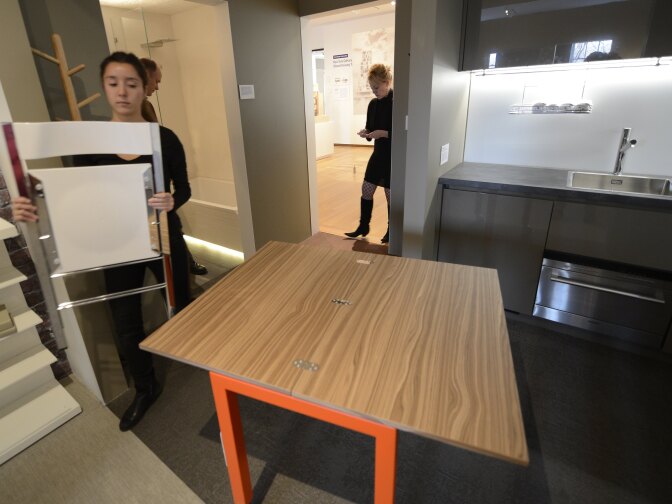 The  dining room table in a fully furnished 325-square-foot studio apartment during an exhibit displaying a transformable "micro-unit"  at the Museum of the City of New York  January  23, 2013 during the opening of a new exhibition, "Making Room: New Housing for New Yorkers" . New York City mayor Michael Bloomberg unveiled yesterday New York City’s first “micro-unit” building will have apartments as small as 250 square feet.     AFP PHOTO / TIMOTHY A. CLARY        (Photo credit should read TIMOTHY A. CLARY/AFP/Getty Images)