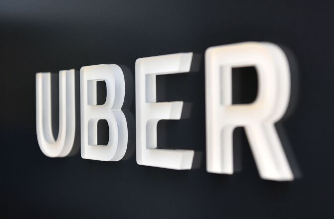 The Uber logo is seen outside the Uber Corporate Headquarters building in San Francisco, California on February 05, 2018. 
The billion-dollar trial pitting Alphabet-owned autonomous driving unit Waymo against Uber started in what could be a blockbuster case between two technology giants over alleged theft of trade secrets. The San Francisco courtroom battle will take place as Waymo and Uber race to perfect self-driving cars that people could summon for rides as desired in a turn away from car ownership.
 / AFP PHOTO / JOSH EDELSON        (Photo credit should read JOSH EDELSON/AFP/Getty Images)
