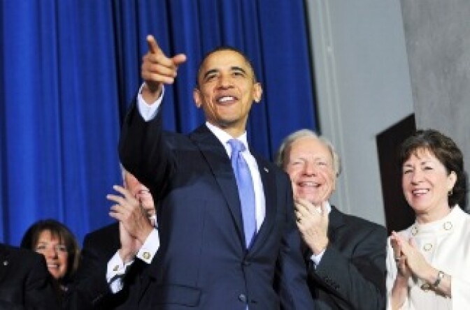 Barack Obama gestures as he arrives to sign the Don't Ask, Don't Tell Repeal Act of 2010 into law.